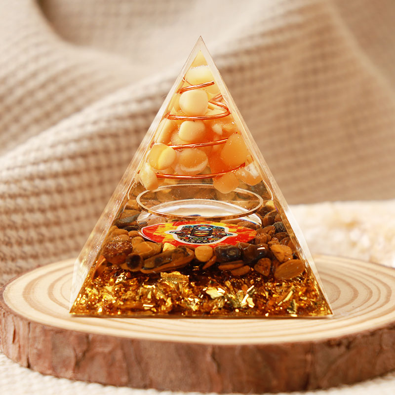 Pierre de soleil Olivenorma avec œil de tigre Pyramide Orgone Hamsa