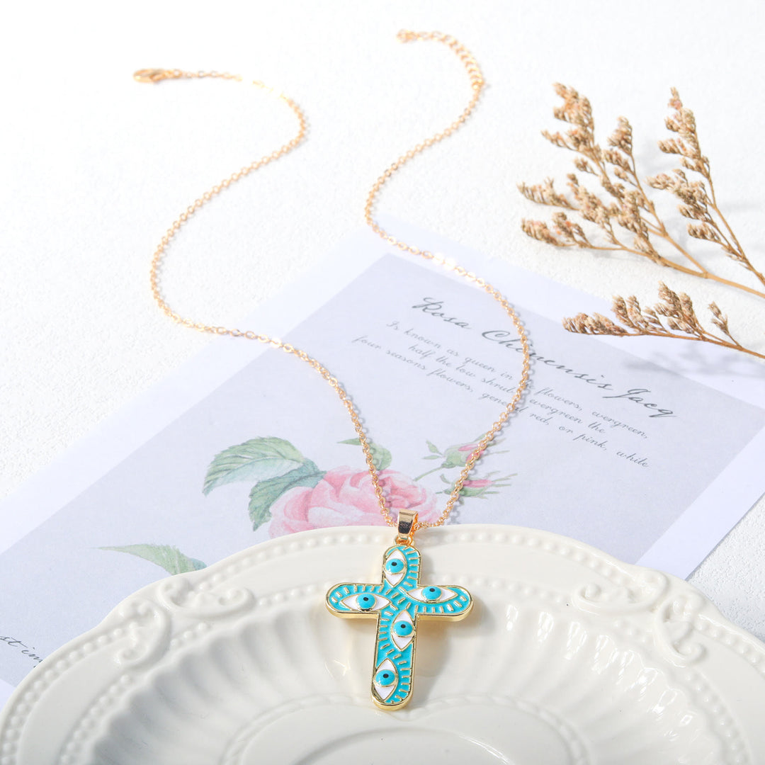 Collier Croix Mauvais Œil Olivenorma « Nous sommes protégés »