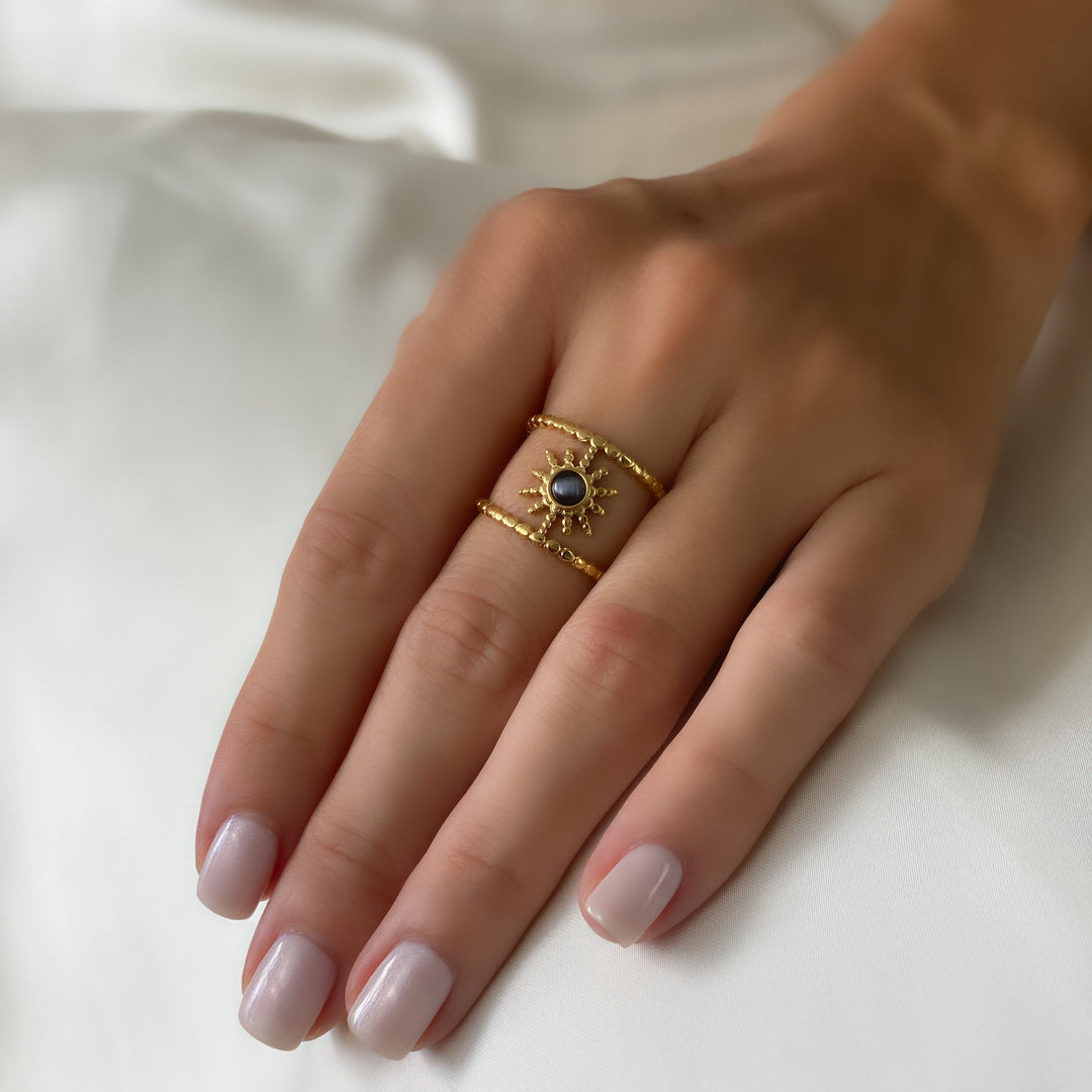 Bague Olivenorma en forme d'étoile à huit branches et à double rangée de tournesols