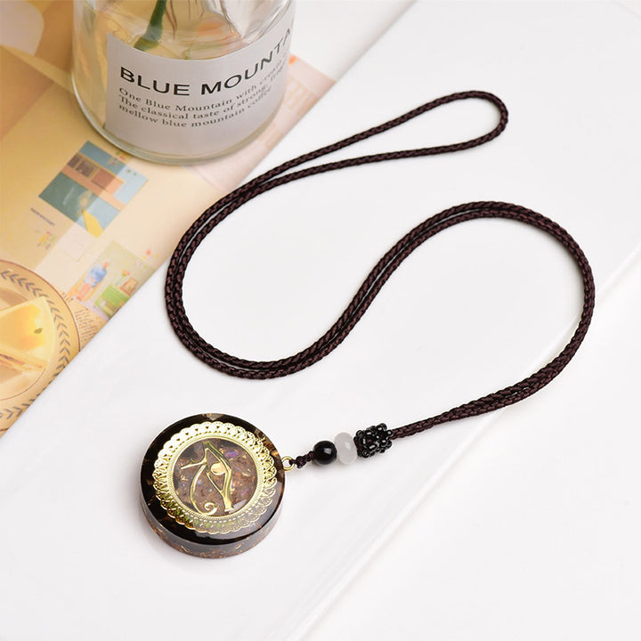 Collier symbole œil d'Horus en obsidienne et agate rouge Olivenorma