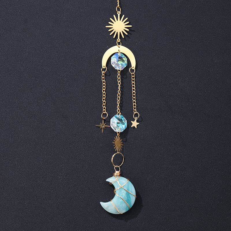 Ornement en cristal fait main avec pierres précieuses en forme de soleil et de lune