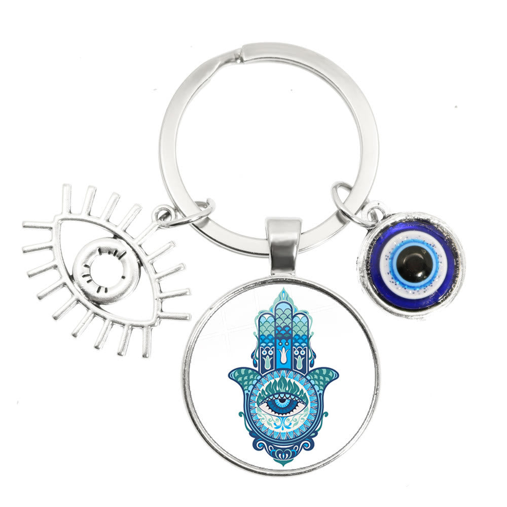 Porte-clés en époxy bleu mauvais œil Hamsa Olivenorma