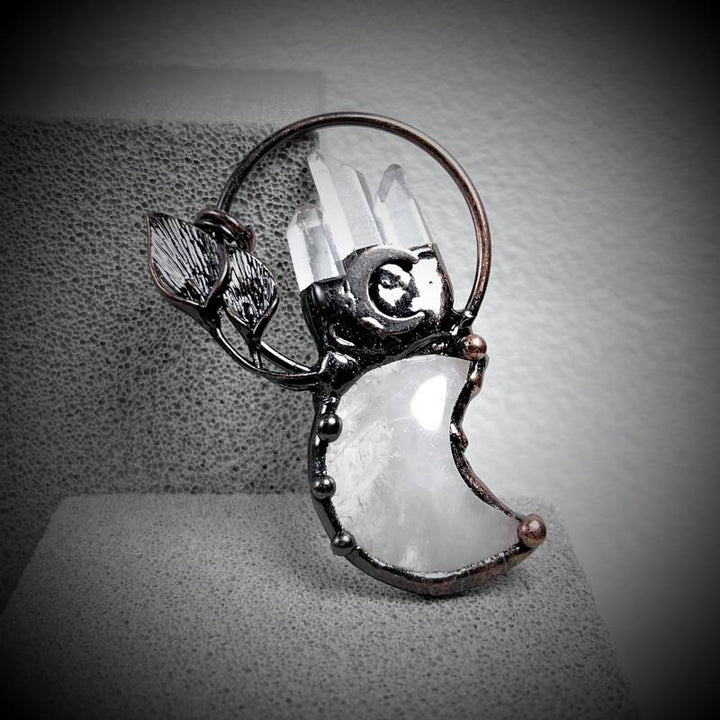 Collier avec pendentif en cristal transparent en forme de lune et de plante en pierres précieuses Olivenorma