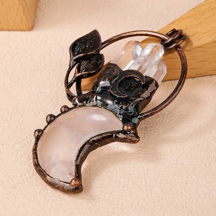 Collier avec pendentif en cristal transparent en forme de lune et de plante en pierres précieuses Olivenorma