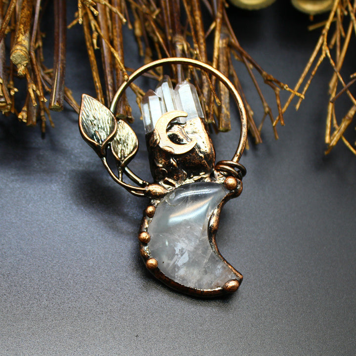 Collier avec pendentif en cristal transparent en forme de lune et de plante en pierres précieuses Olivenorma
