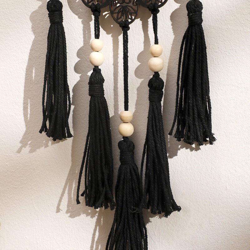 Décoration murale artisanale en bois avec pompon en forme de mauvais œil et Hamsa Olivenorma