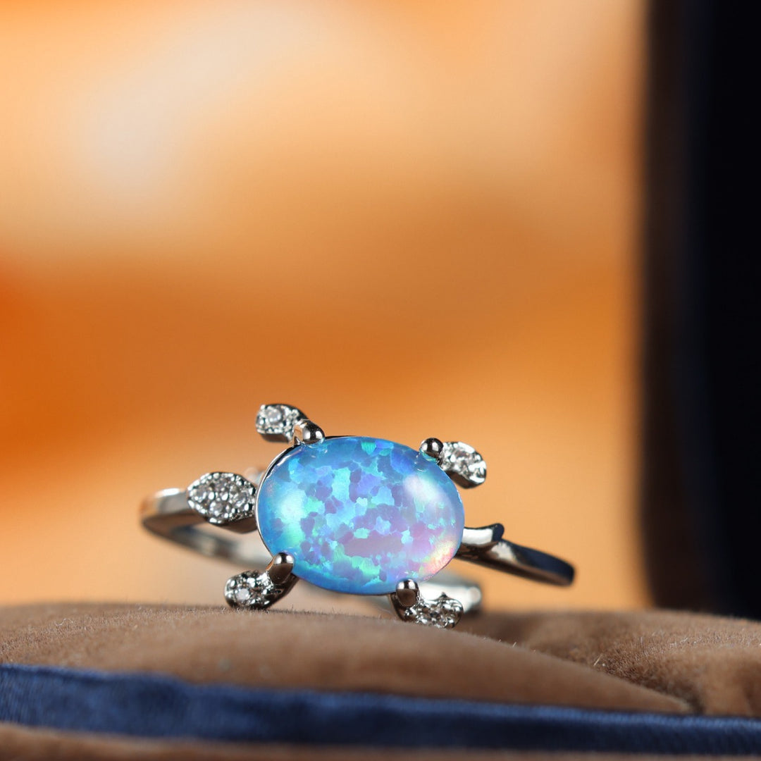 Bague Olivenorma en forme de tortue de mer mignonne avec opale bleue
