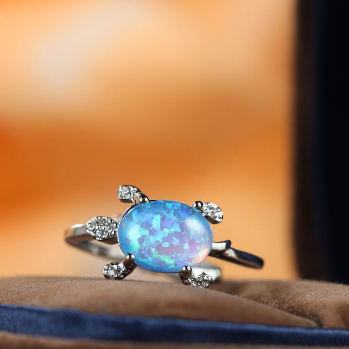 Bague Olivenorma en forme de tortue de mer mignonne avec opale bleue