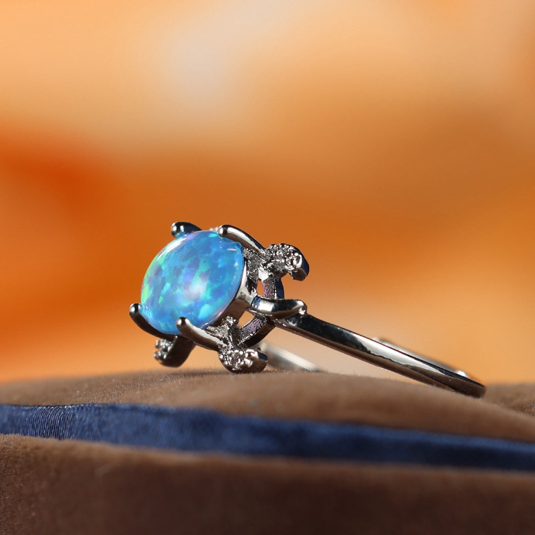 Bague Olivenorma en forme de tortue de mer mignonne avec opale bleue
