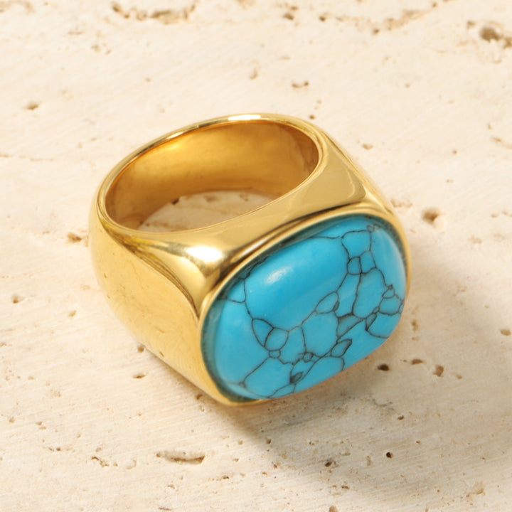 Bague en acier titane et turquoise avec pierre ovale œil de chat Olivenorma
