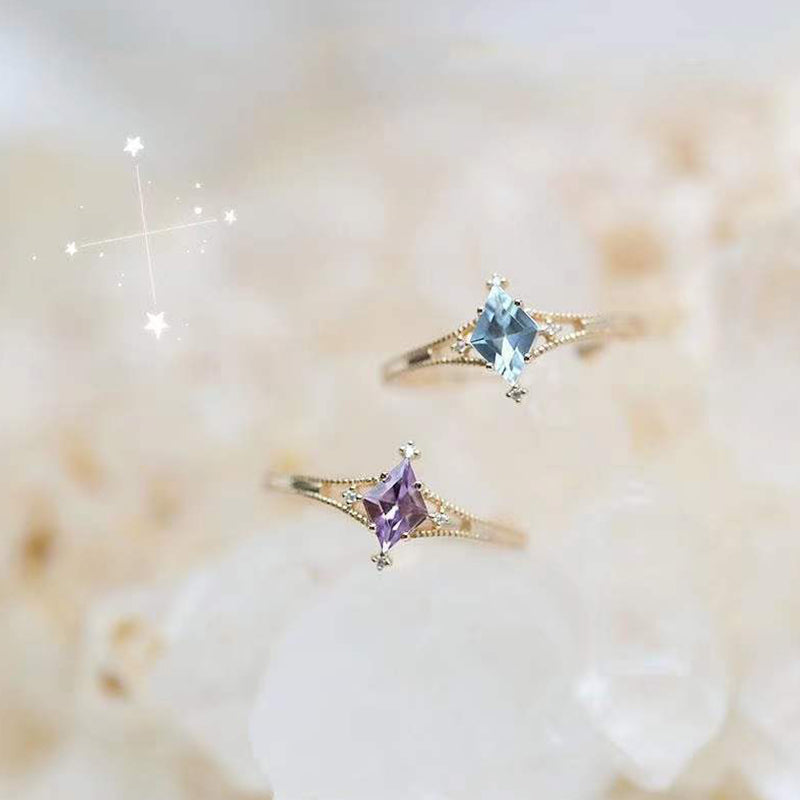 Bague de guérison en forme d'étoile avec topaze bleue et améthyste Olivenorma