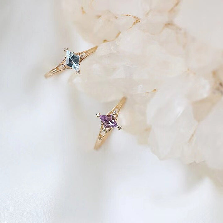 Bague de guérison en forme d'étoile avec topaze bleue et améthyste Olivenorma