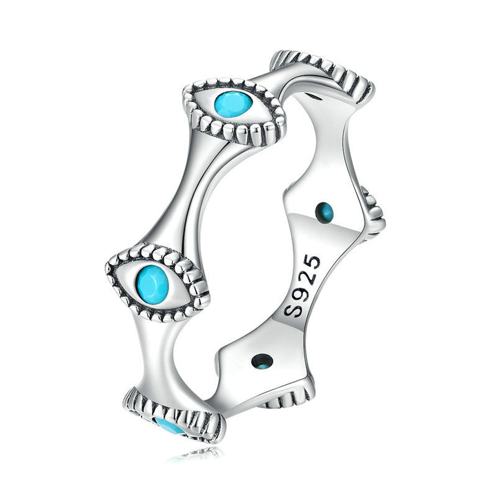 Boucles d'oreilles à tige en forme de croix solaire et mauvais œil turquoise Olivenorma