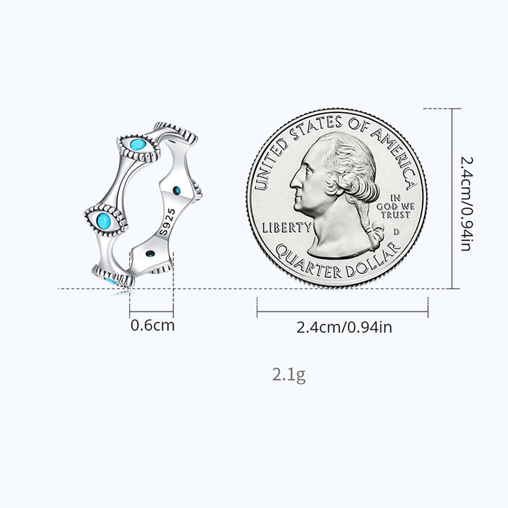 Boucles d'oreilles à tige en forme de croix solaire et mauvais œil turquoise Olivenorma