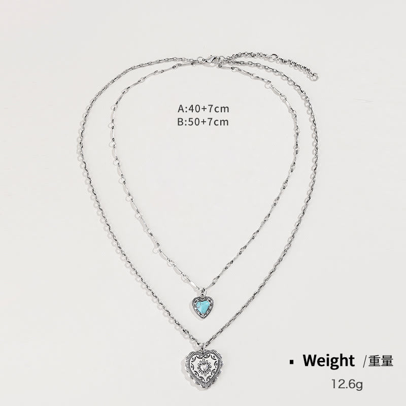 Ensemble de bijoux avec pendentif et boucles d'oreilles en forme de croix d'amour turquoise Olivenorma