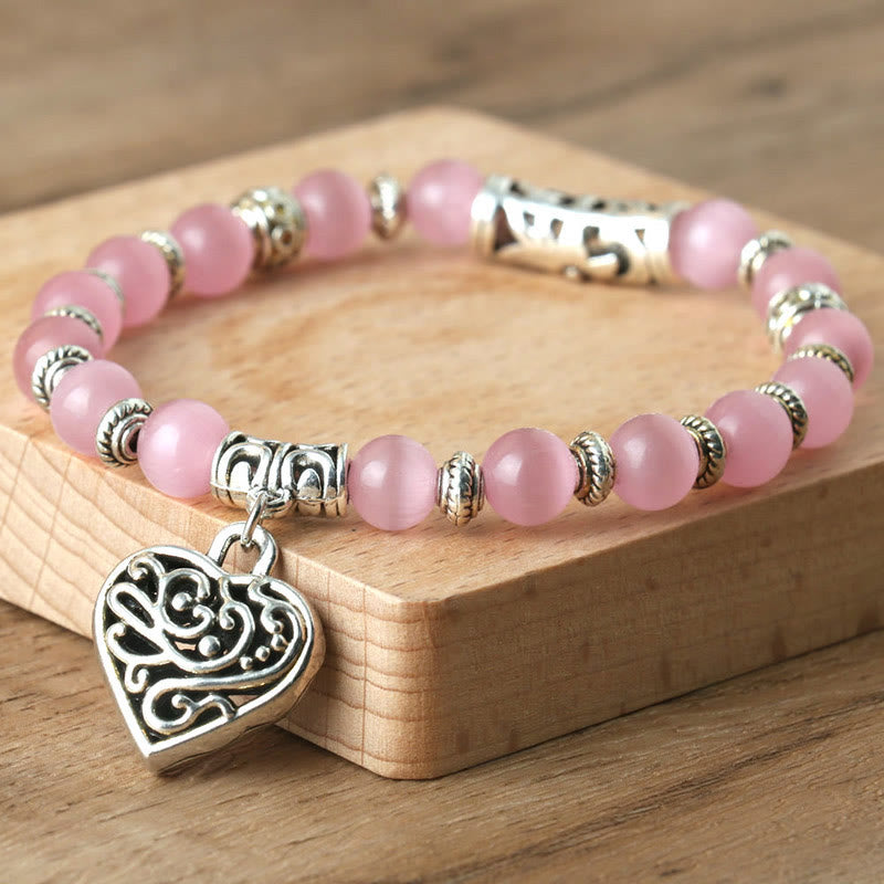 Bracelet œil de chat rose avec pendentif Hollow Love Olivenorma