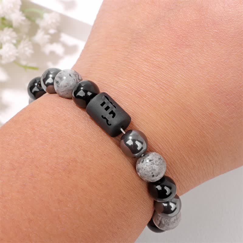 Bracelet en perles d'obsidienne, de jaspe gris et d'hématite avec signe du zodiaque Olivenorma