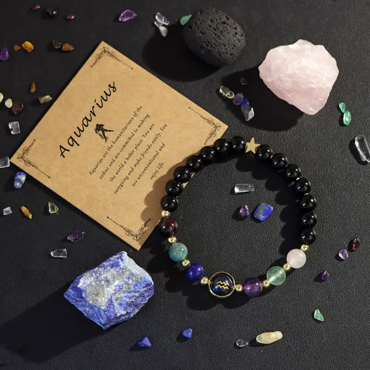 Bracelet en perles de grès bleu et onyx noir avec signe du zodiaque Olivenorma