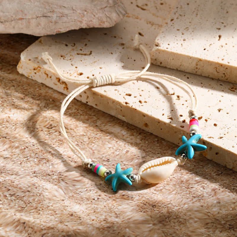 Bracelet de plage avec pendentif tortue étoile de mer turquoise blanche Olivenorma