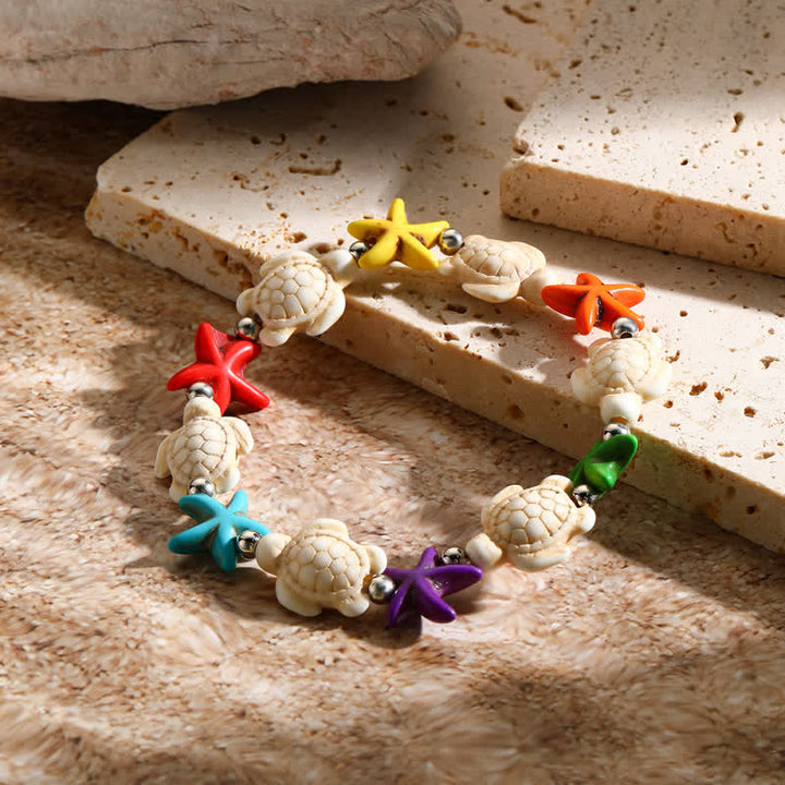 Bracelet de plage avec pendentif tortue étoile de mer turquoise blanche Olivenorma