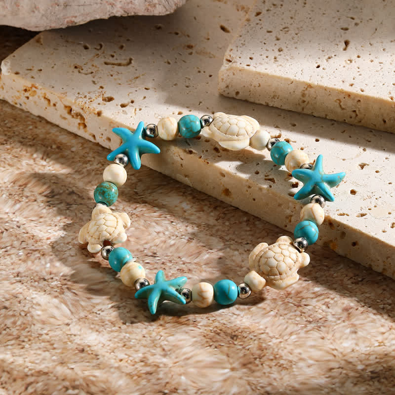 Bracelet de plage avec pendentif tortue étoile de mer turquoise blanche Olivenorma