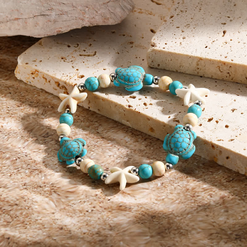 Bracelet de plage avec pendentif tortue étoile de mer turquoise blanche Olivenorma