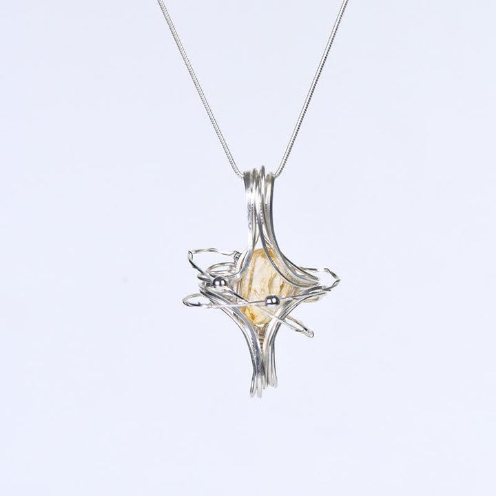 Collier pendentif planète octaédrique enroulé à la main en cristal naturel Olivenorma