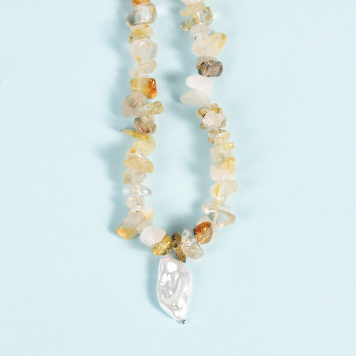 Collier avec pendentif en perles de gravier naturel et perles de soleil et de lune Olivenorma