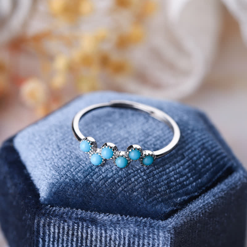 Bague de couple créative ronde à quatre griffes en turquoise Olivenorma