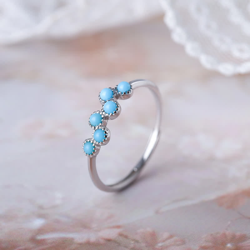 Bague de couple créative ronde à quatre griffes en turquoise Olivenorma