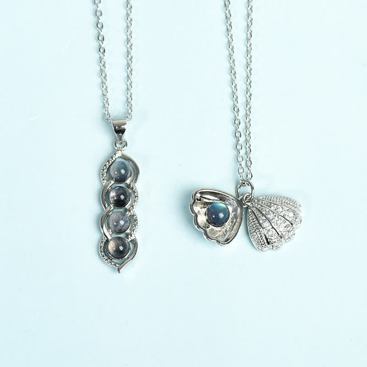 Ensemble de bijoux avec pendentif en coquillage de labradorite et pois Olivenorma et flocon de neige