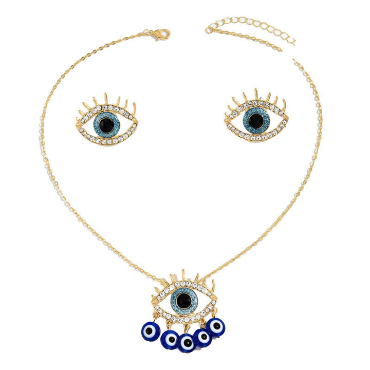 Bijoux Olivenorma en zircon blanc et topaze bleue avec mauvais œil