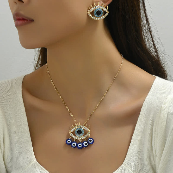 Bijoux Olivenorma en zircon blanc et topaze bleue avec mauvais œil