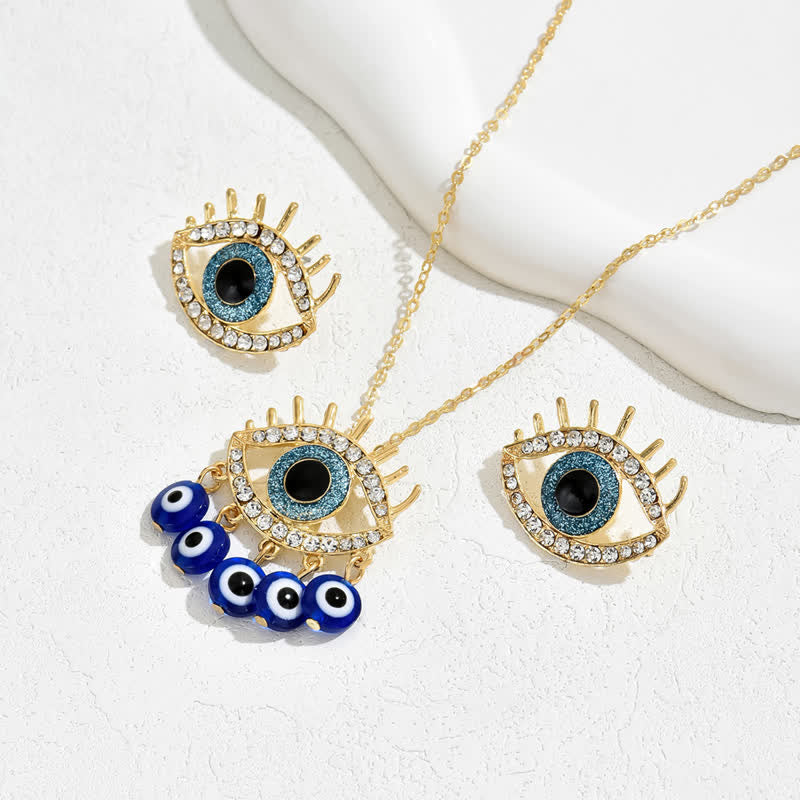 Bijoux Olivenorma en zircon blanc et topaze bleue avec mauvais œil