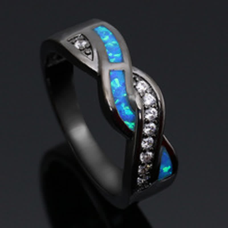 Bague Olivenorma en or noir et opale bleue ondulée avec zircon