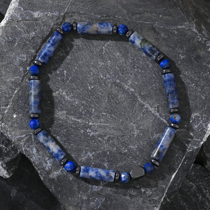 Bracelet Olivenorma en perles de sodalite bleue et bande d'hématite naturelle