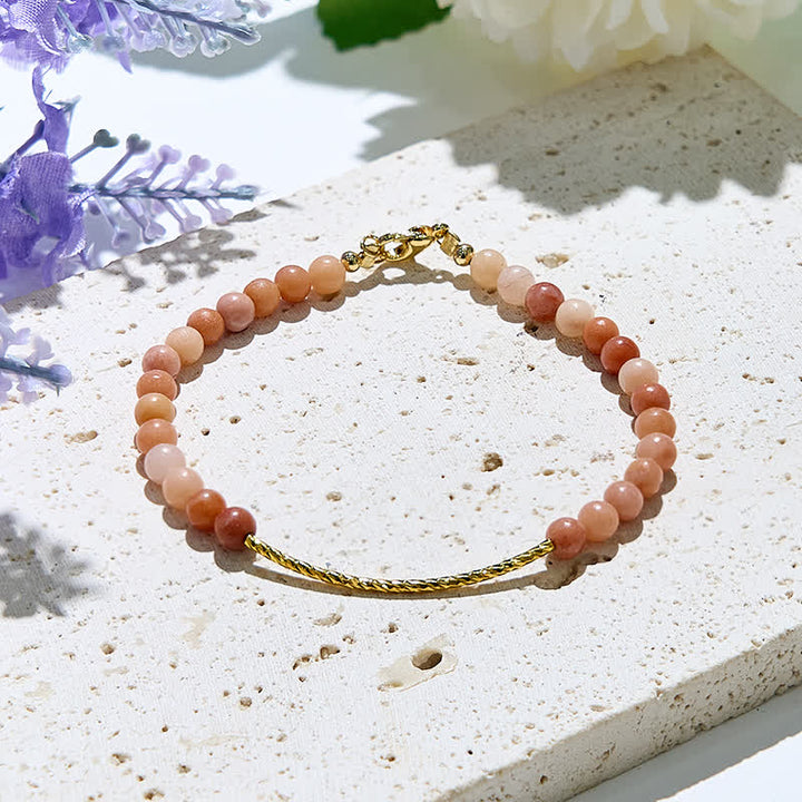 Bracelet Olivenorma en perles de rhodochrosite naturelle de 2 mm