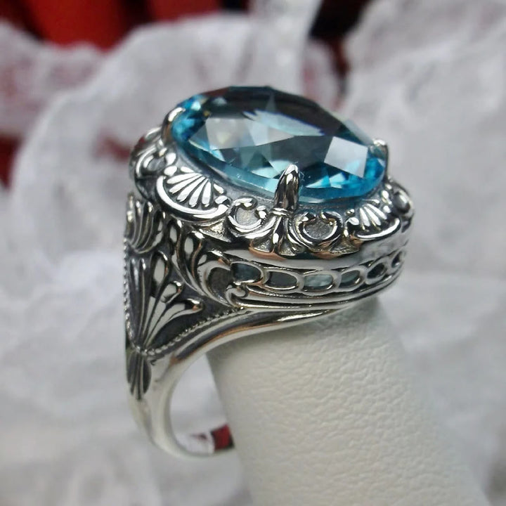 Bague rétro Olivenorma avec pierre précieuse sculptée à facettes aigue-marine