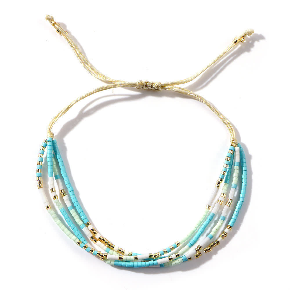 Bracelet de plage tressé en perles de riz bleu et blanc Olivenorma