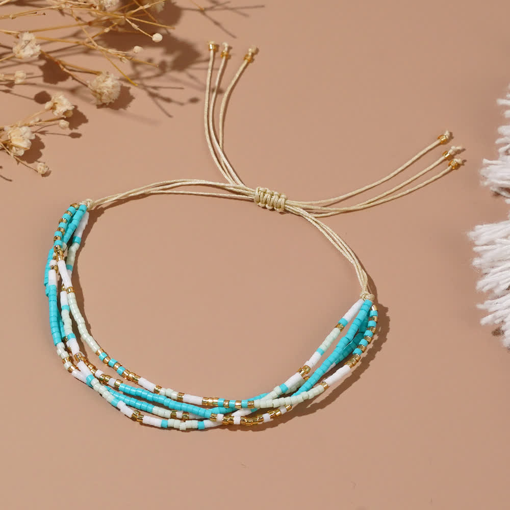 Bracelet de plage tressé en perles de riz bleu et blanc Olivenorma