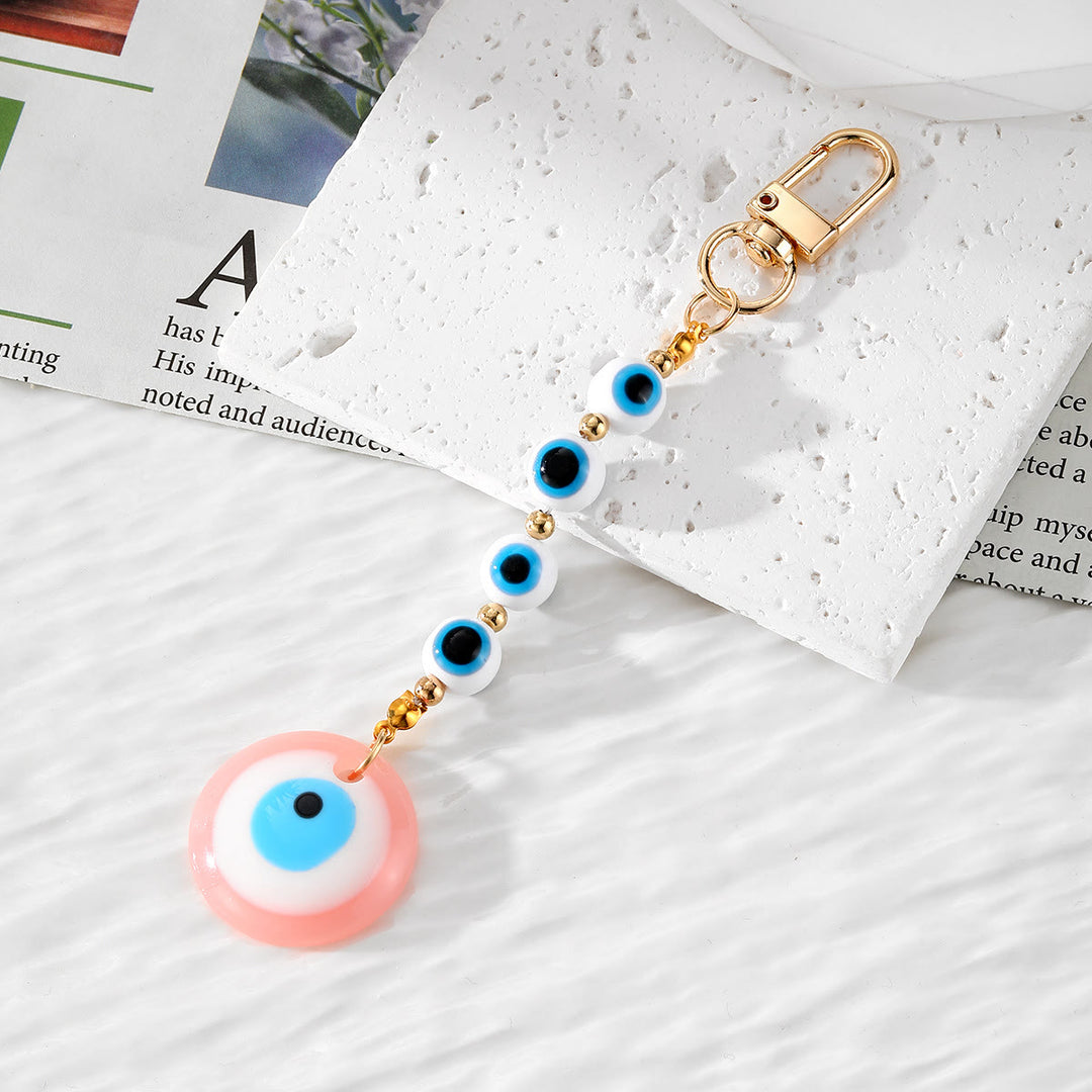 Porte-clés décoratif en résine fait main Olivenorma en forme de mauvais œil