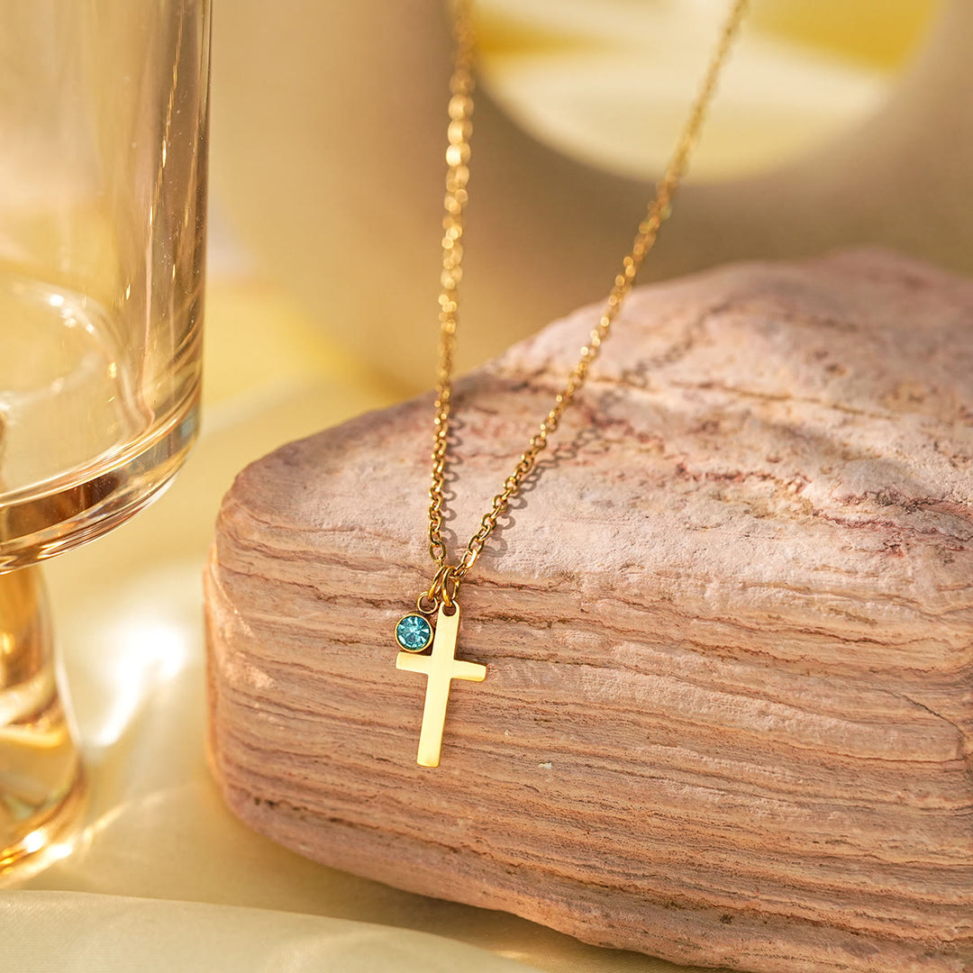 Collier à breloques Olivenorma avec croix aigue-marine et symbole du mauvais œil Hamsa