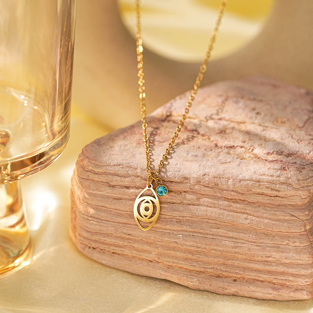 Collier à breloques Olivenorma avec croix aigue-marine et symbole du mauvais œil Hamsa