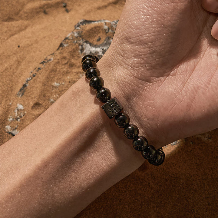 Bracelet en perles d'obsidienne en pierre de lave taillée en cube Olivenorma