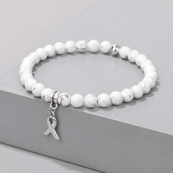 Bracelet porte-bonheur en perles de pierres précieuses naturelles avec breloque ruban Olivenorma