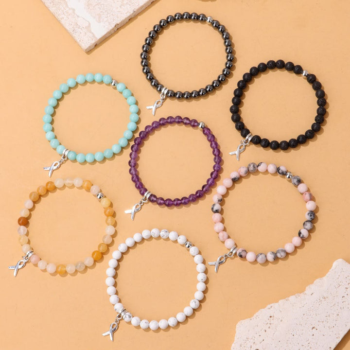 Bracelet porte-bonheur en perles de pierres précieuses naturelles avec breloque ruban Olivenorma