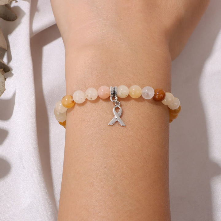 Bracelet porte-bonheur en perles de pierres précieuses naturelles avec breloque ruban Olivenorma