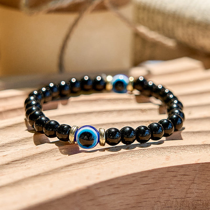 Bracelet de perles contre le mauvais œil en onyx noir naturel Olivenorma