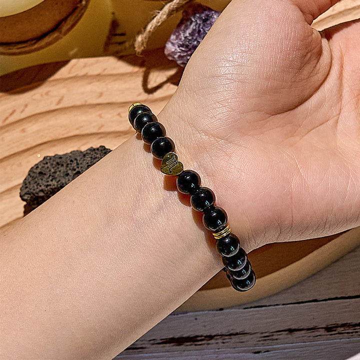 Bracelet de perles en obsidienne naturelle avec signe du zodiaque Olivenorma