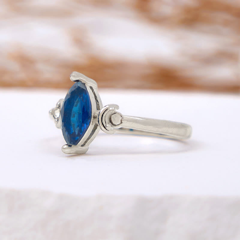 Bague Olivenorma en topaze bleue taille marquise et zircon blanc